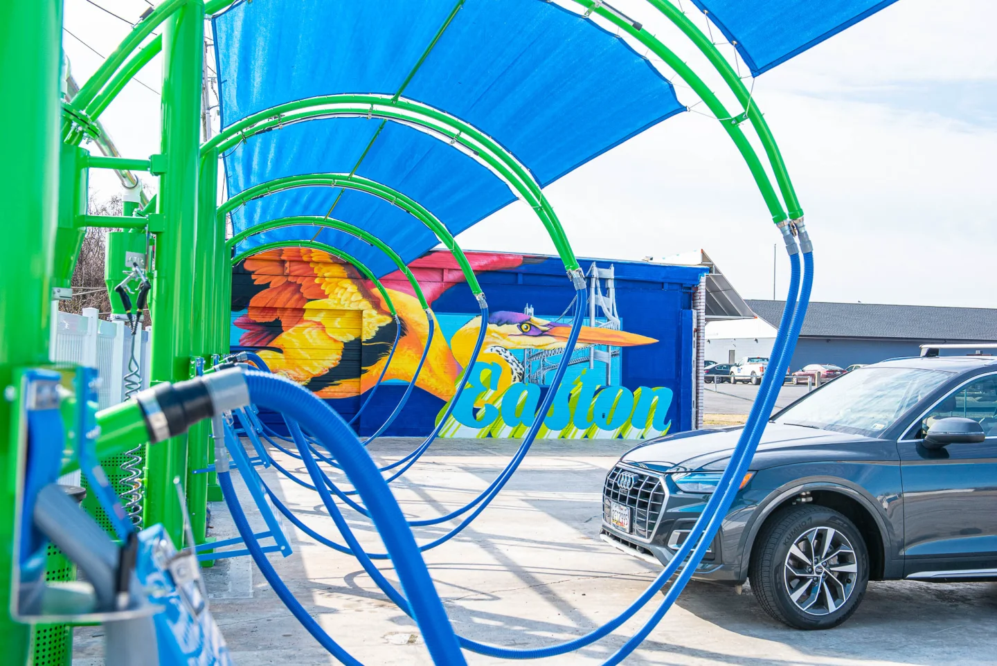 GO! Wash Easton self-serve equipment with the colorful Easton mural in the background